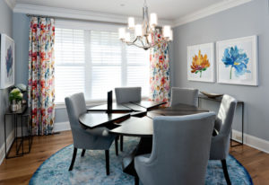 gray dining room gray chairs gray walls floral curtains