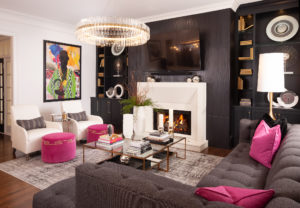 black and white living room with black accent wall and pink accessories