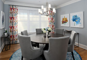 Gray dining room with gray chairs and gray walls