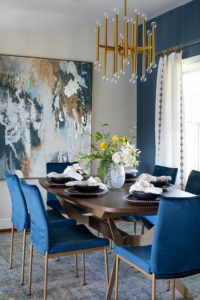 blue and white dining room with blue chairs and white wall blue accent wall