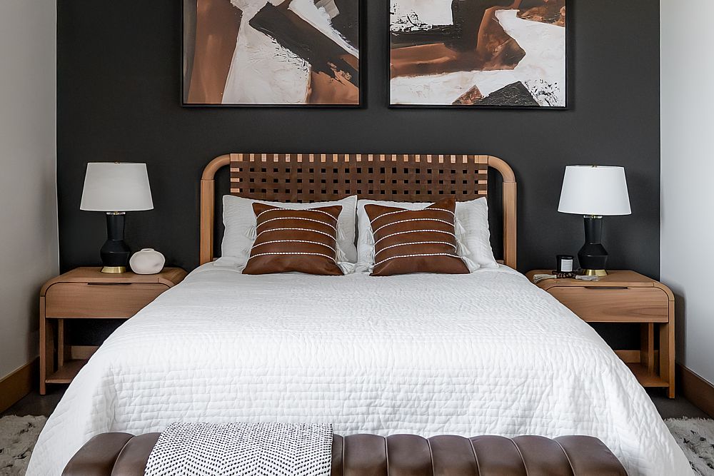 Dark walls contrast with white in this loft bedroom.